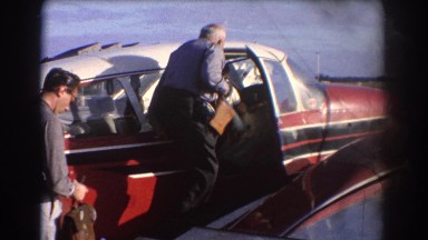 1967: man and woman boarding a small twin-prop airplane PERTH AUSTRALIA