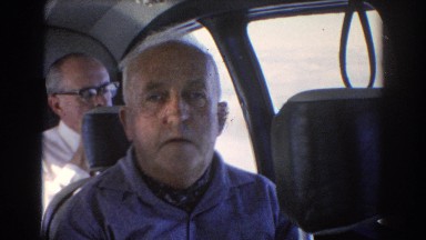 1967: a group of men sit close next to each other in seats