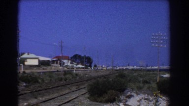1967: under the blue sky the beautiful township with a railroad passing through