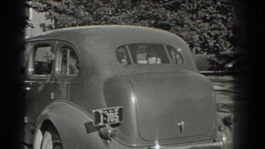 1937: vehicle traveling around a bend surrounded by vegetation SOUTHAMPTON