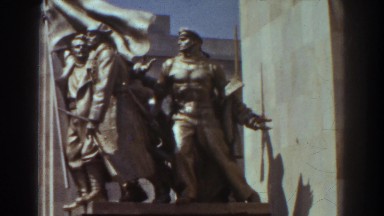 1939: a statue in front of a pillar like building NEW YORK WORLDS FAIR