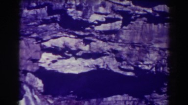 1938: rocky outcropping with a waterfall running through BLACKWATER FALLS