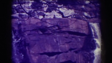 1938: a waterfall pours down steep cliffs into the river BLACKWATER FALLS WEST