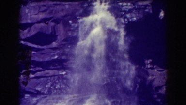 1938: water falling into a large opening BLACKWATER FALLS WEST VIRGINIA