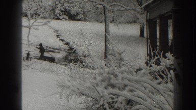 1938: child makes a snowball and puts it in his wagon MARTINSBURG WEST VIRGINIA