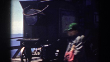 1938: passengers casually strolling past a locomotive and dinner car