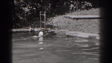1938: young woman swimming alone in an outdoor pool NEW JERSEY