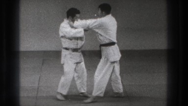 1965: Two Karatekas Compete on Tatami, One Thrown to Floor