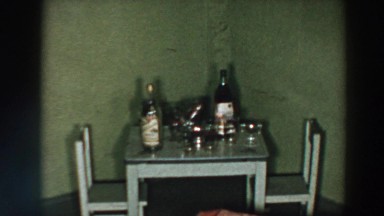 1957: a small dining table for two people with drinks and cups on top WHEELING