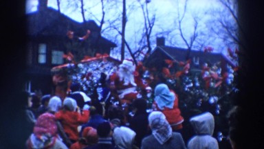 1957: santa claus dressed man cheering people outdoor WHEELING OHIO