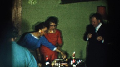 1957: people gathering for family reunion toast each other WHEELING OHIO