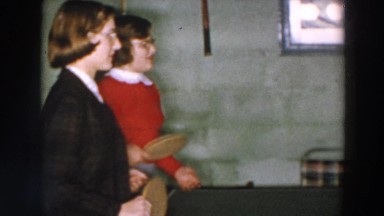 1957: two young women play paddle ball game WHEELING OHIO