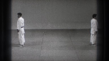 1971: a black belt educates a lower belt in an educational video TOKYO JAPAN