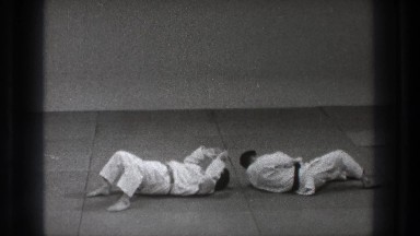 1971: karate masters illustrate avoidance moves in a dojo. TOKYO JAPAN