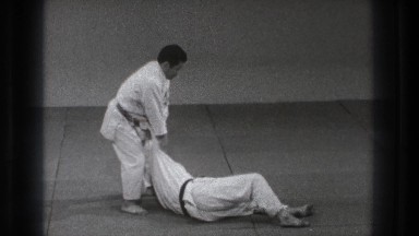 1971: people practicing self defense moves on a floor TOKYO JAPAN
