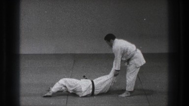 1971: two people practicing self defense moves on a mat TOKYO JAPAN