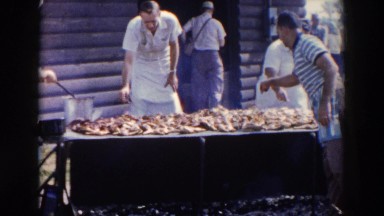 1957: men at large barbeque, preparing, cooking and flipping meat