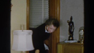 1957: woman cleans living area WHEELING OHIO