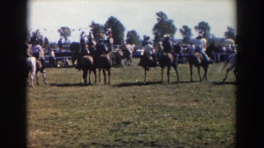 1957: horse are circling the arena at a gallop in a barrel