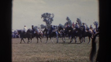 1957: group of people supporting their country riding horses WHEELING OHIO
