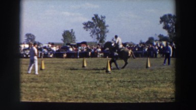 1957: a horse and rider performing stunts for an audience WHEELING OHIO