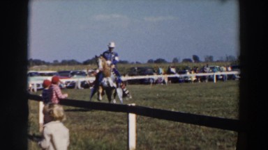 1957: people outside riding on animals WHEELING OHIO