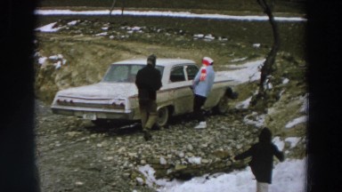 1958: a family enjoying a day out on a mildly snowy day ITALY