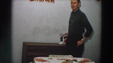 1958: man standing beside the dinner table. ITALY