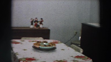 1958: man looks over dining room preparations for christmas dinner ITALY