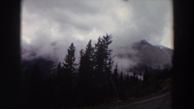 1964: misty clouds floating around rocky mountain peaks. WASHINGTON