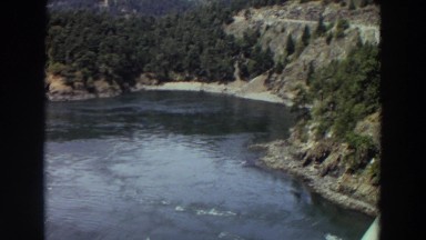 1964: view of a very calm huge lake and land with trees among it WASHINGTON