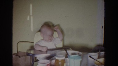 1965: baby in highchair waits with sister for lunch. FALLSTON MARYLAND