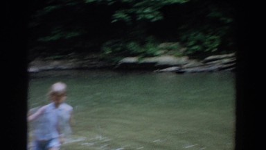 1965: kids splash, wade, and swim in local watering hole FALLSTON MARYLAND