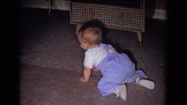 1965: little baby learning to crawl on the front room carpet. FALLSTON MARYLAND