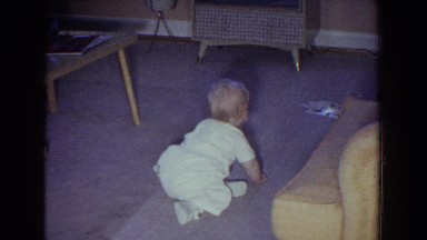 1965: little baby crawling on the floor of the living room. FALLSTON MARYLAND