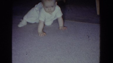 1965: Baby Crawling on Carpet Reaching for Playing Cards