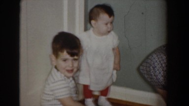 1960: a little boy, his baby sister, and his mom in the living room BEL AIR