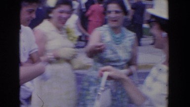 1960: people gathered around smiling and celebrating outside BEL AIR MARYLAND