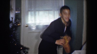 1960: young boy so happy to get his gift on christmas morning. BEL AIR MARYLAND