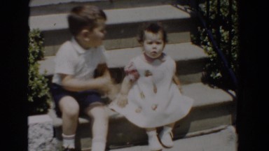 1960: two small children sitting on the porch steps. BEL AIR MARYLAND
