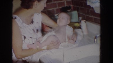 1965: mom pacifying little baby who is restless after a nap FALLSTON MARYLAND