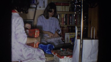 1965: children of different ages are sorting and checking the presents in a room