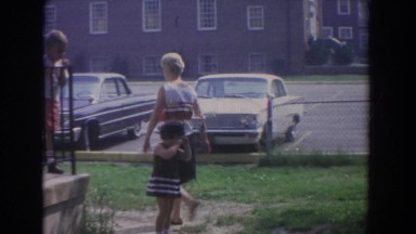 1965: girl crying as she visits the neighbors. FALLSTON MARYLAND