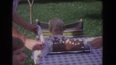 1965: little kid blowing out his candles on his birthday. FALLSTON MARYLAND