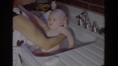 1965: awesome scene of mom bathing the cute baby in the sink FALLSTON MARYLAND