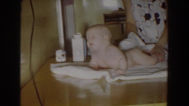 1965: mom is wiping the little baby on the table after bath FALLSTON MARYLAND