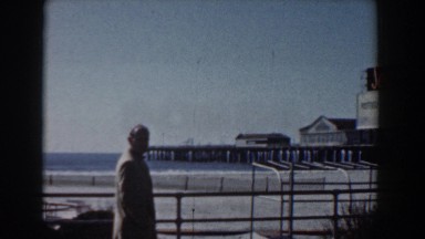 1958: man walks along the pier by the ballantine ale shop. YORKTOWN VIRGINIA