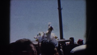 1958: a man is moving through the crowd with a magnificent cap YORKTOWN VIRGINIA