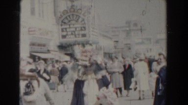 1958: retro people shown in market rushing here and there