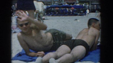 1958: people relaxing at the beach on a sunny day YORKTOWN VIRGINIA